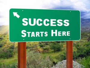 Success starts here sign