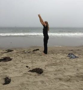 lady in beach stretching