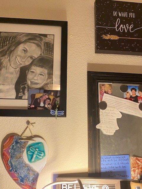 Various personal pictures of family and meaningful amulets pictured. Personal pictures and amulets can remind you to define and stay the course of your self-care goals. 
